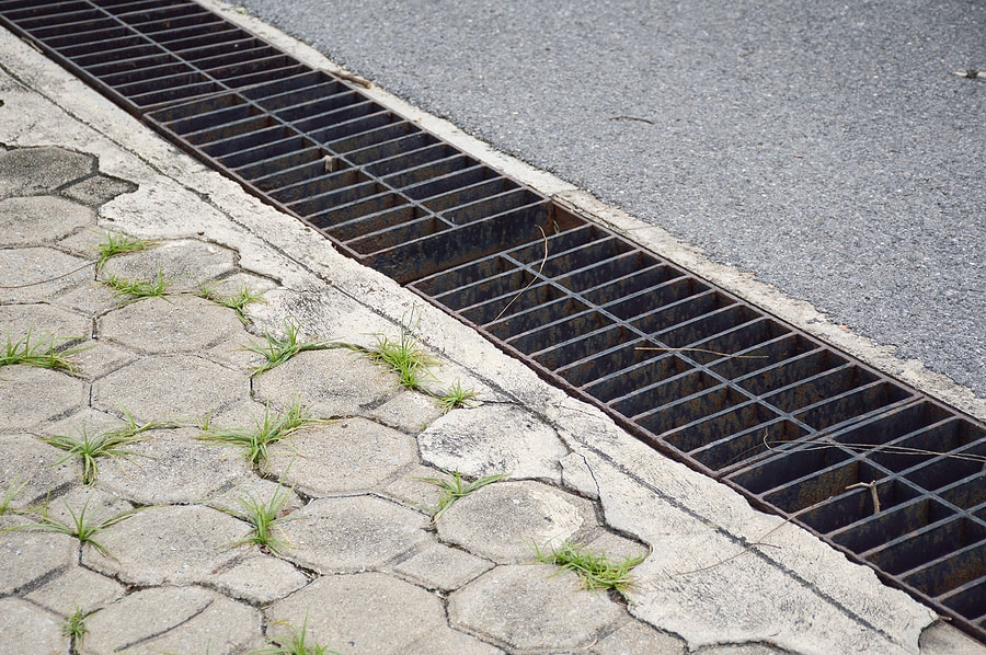 commercial french drain on sidewalk